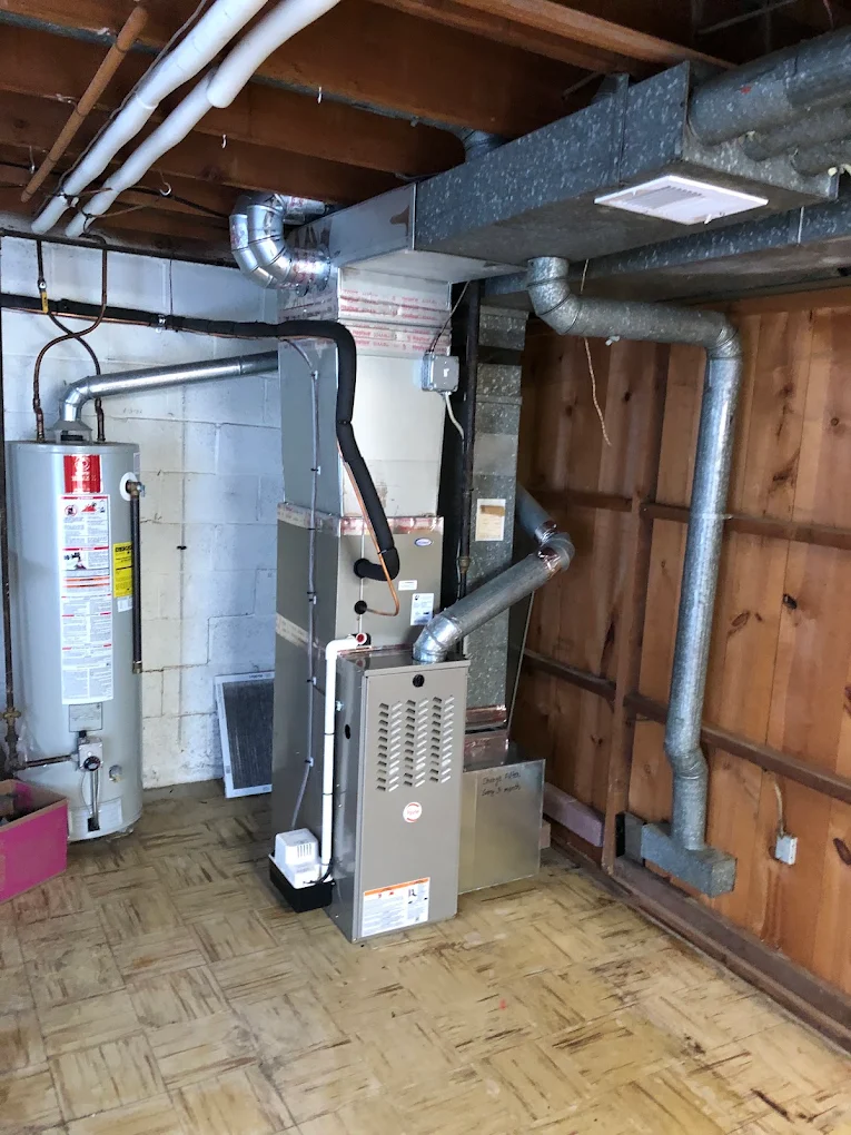 Gas furnace and air handler with new sheet metal ductwork in a Maryland basement