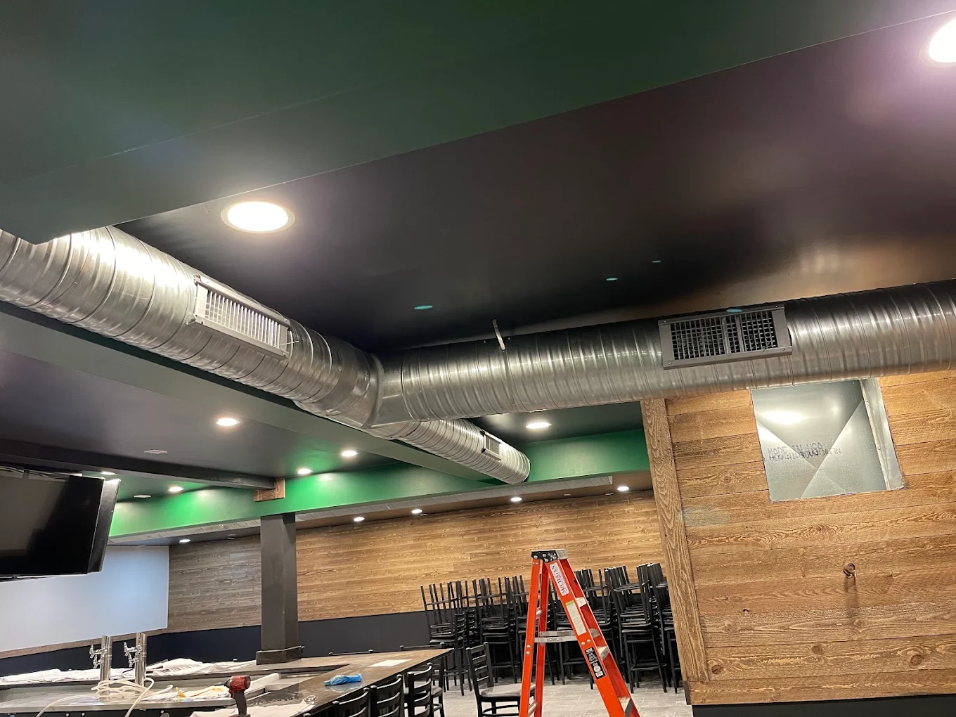 Exposed spiral duct and diffuser install for a commercial restaurant build-out. Exposed spiral ductwork and supply registers installed in a commercial restaurant in Anne Arundel County, MD